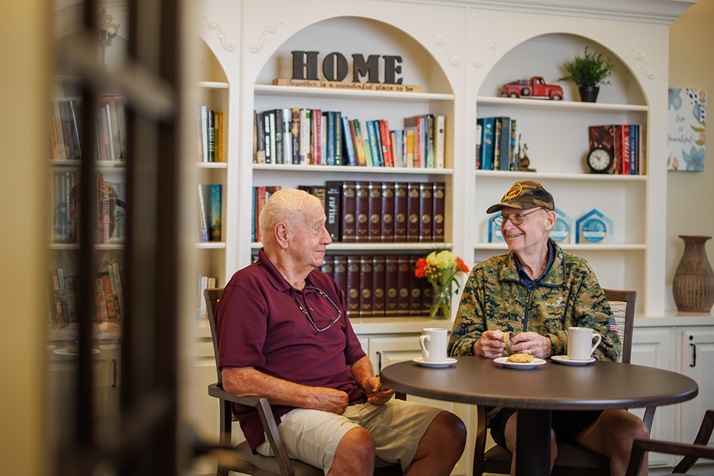 Two men socializing with coffee