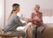 Family member discussing memory care with a senior woman
