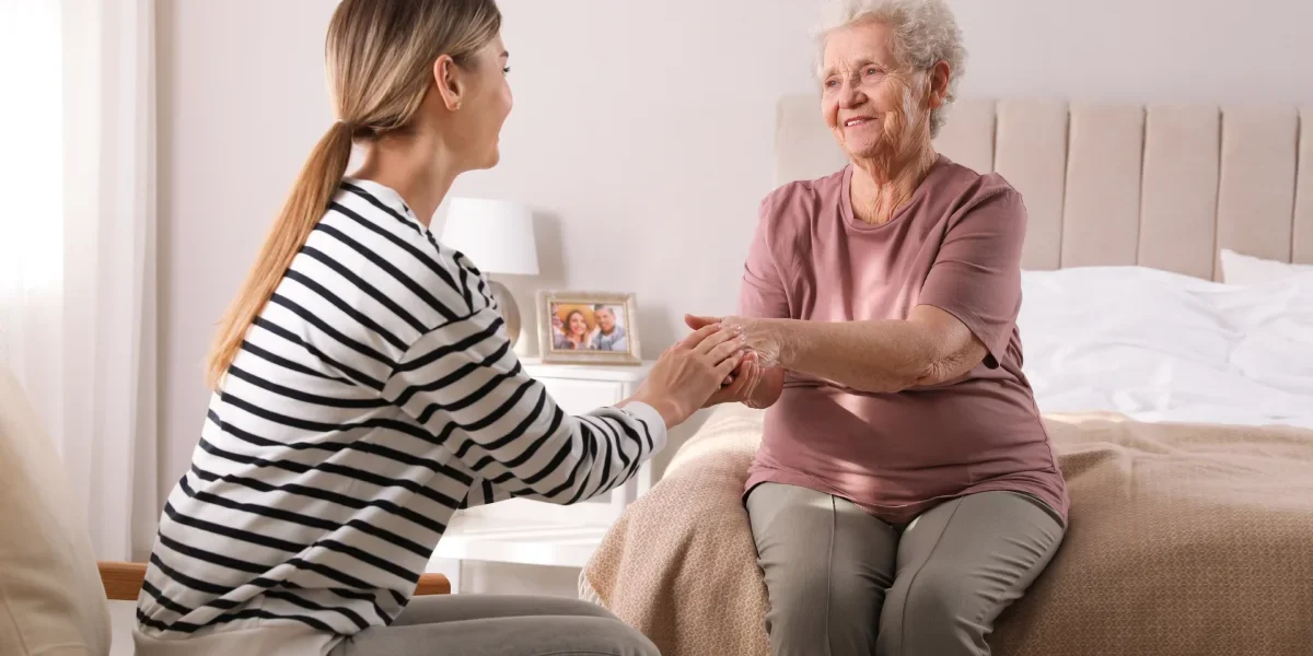 Family member discussing memory care with a senior woman