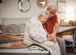 Senior couple sitting on a bed